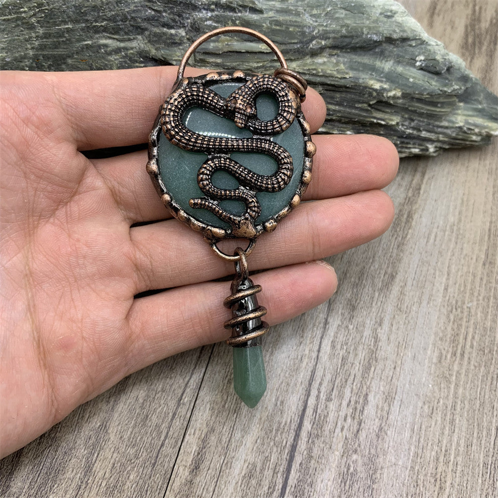 ntique copper snake earrings with natural teal crystal disc and green jade point, wire wrapped mystical jewelry