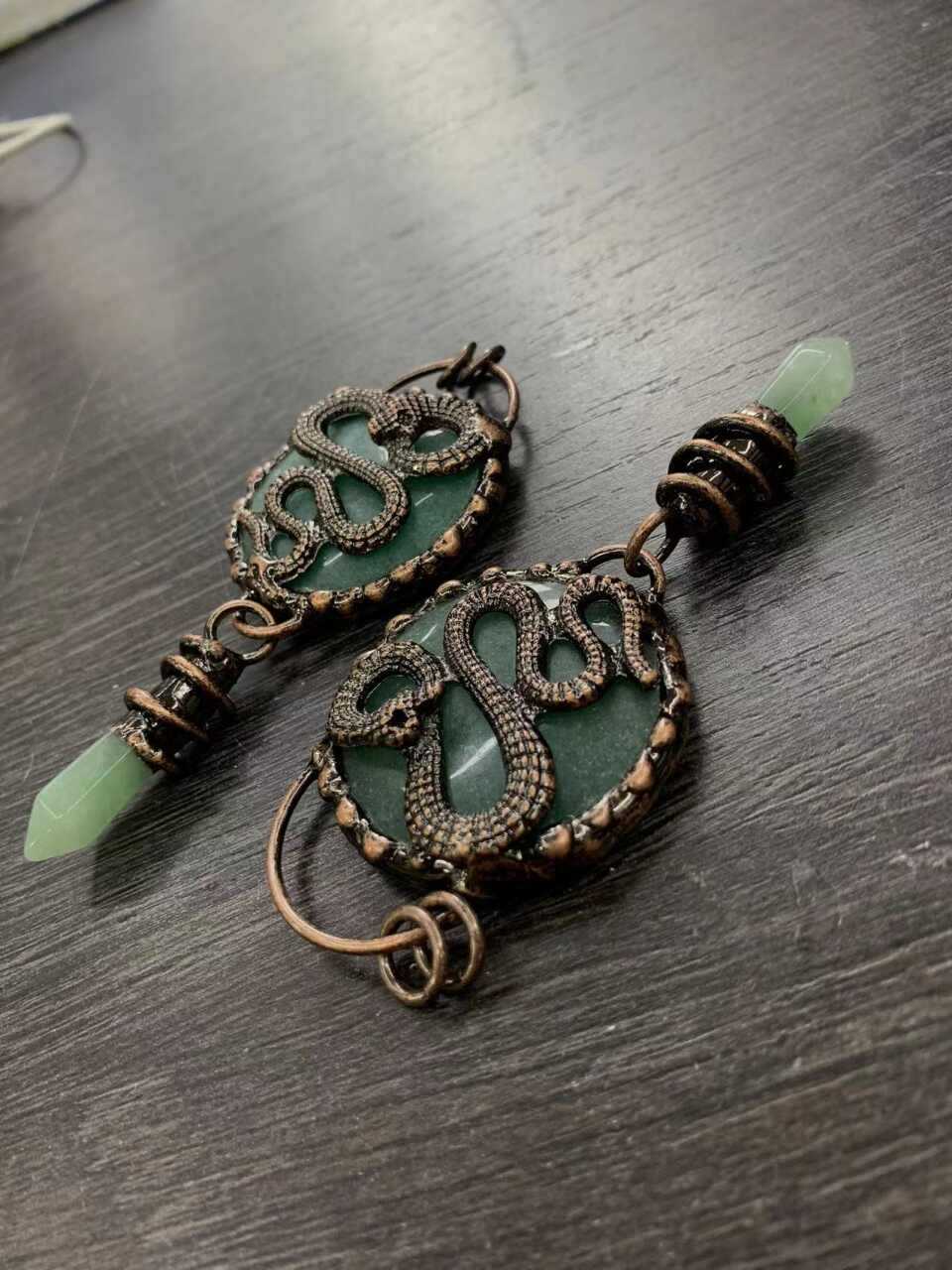 ntique copper snake earrings with natural teal crystal disc and green jade point, wire wrapped mystical jewelry